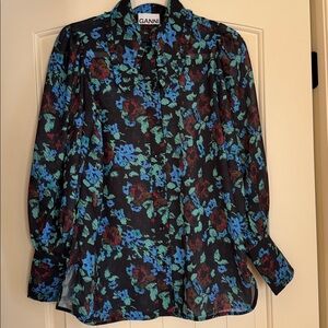 Ganni design from Copenhagen  floral blouse with ruffled pointed collar.